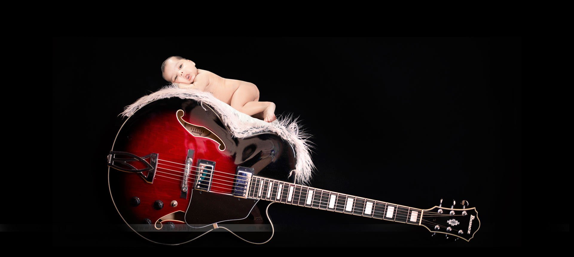 Theme picture- baby on Guitar